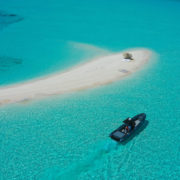Boat on crystal clear water in the Bahama